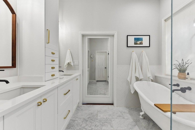 340 Palo Alto Way, Austin, TX 78732 - full bathroom featuring marble look tile flooring, double vanity, and a freestanding bath