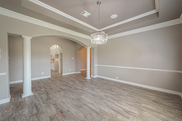 13403 Lakemeade Ct, Sugar Land, TX 77498 - unfurnished dining area with a raised ceiling, light wood-style floors, baseboards, a chandelier, and ornamental molding