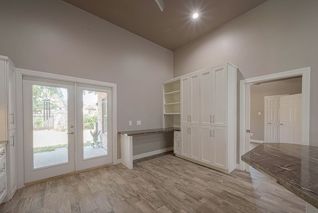 13403 Lakemeade Ct, Sugar Land, TX 77498 - doorway to outside with french doors, a high ceiling, light wood-style floors, and baseboards