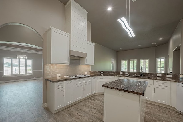 13403 Lakemeade Ct, Sugar Land, TX 77498 - kitchen featuring a sink, decorative backsplash, light wood finished floors, butcher block counters, and white cabinets