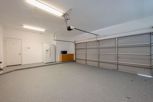 13403 Lakemeade Ct, Sugar Land, TX 77498 - garage featuring white fridge with ice dispenser and a garage door opener