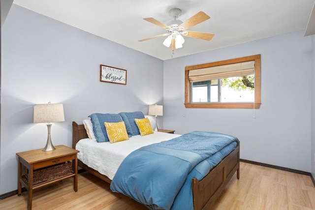 109 N Hill Top Dr, Boerne, TX 78006 - bedroom featuring light wood-style floors, baseboards, and a ceiling fan