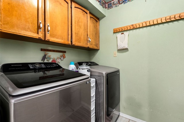 109 N Hill Top Dr, Boerne, TX 78006 - clothes washing area featuring cabinet space, washing machine and clothes dryer, and baseboards