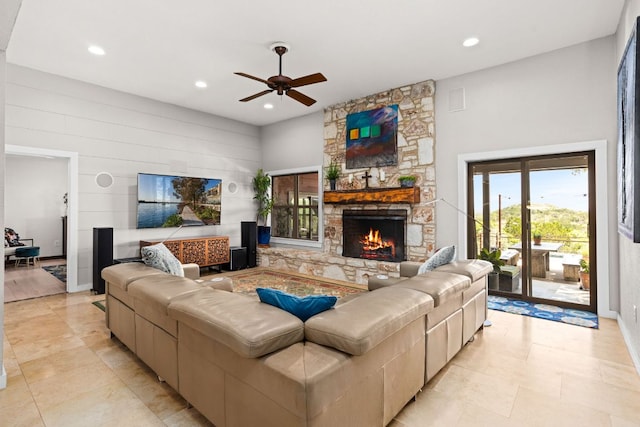 109 N Hill Top Dr, Boerne, TX 78006 - living room with a ceiling fan, a fireplace, recessed lighting, a high ceiling, and baseboards