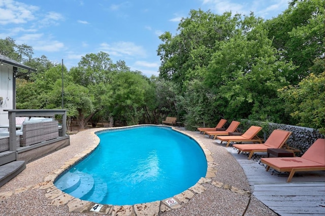 12001 Bittern Holw, Austin, TX 78758 - swimming pool with view of scattered trees and a deck
