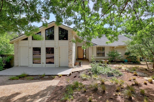 12001 Bittern Holw, Austin, TX 78758 - mid-century modern home featuring a shingled roof