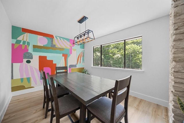 12001 Bittern Holw, Austin, TX 78758 - dining space featuring wood finished floors and a chandelier