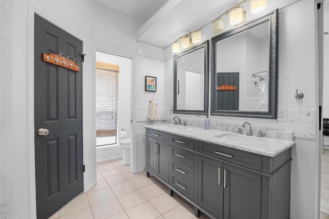 12001 Bittern Holw, Austin, TX 78758 - full bath with double vanity and tile patterned flooring