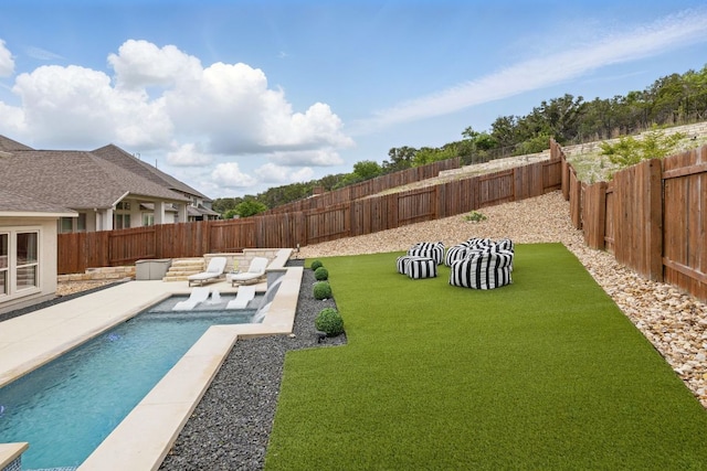 view of pool featuring a patio