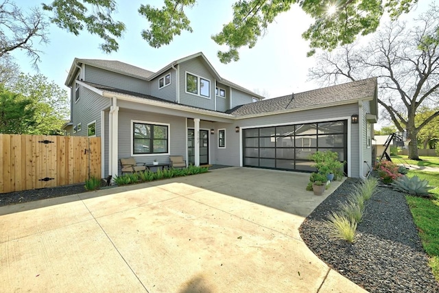 3102 Hunt Trl, Austin, TX 78757 - traditional-style house with fence, driveway, an attached garage, and a porch