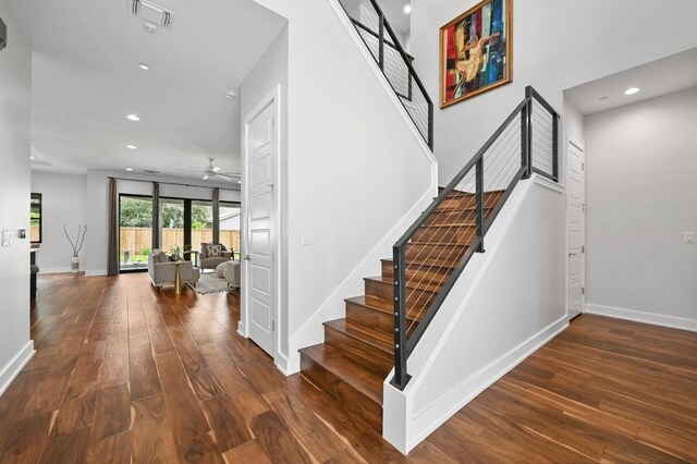 3102 Hunt Trl, Austin, TX 78757 - staircase with a ceiling fan, hardwood / wood-style floors, recessed lighting, and baseboards