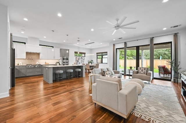 3102 Hunt Trl, Austin, TX 78757 - living area featuring a ceiling fan, recessed lighting, and wood finished floors