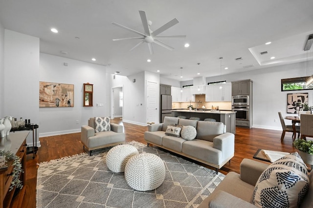 3102 Hunt Trl, Austin, TX 78757 - living area featuring a ceiling fan, dark wood finished floors, baseboards, and recessed lighting