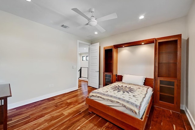 3102 Hunt Trl, Austin, TX 78757 - bedroom with baseboards, wood finished floors, recessed lighting, and ceiling fan
