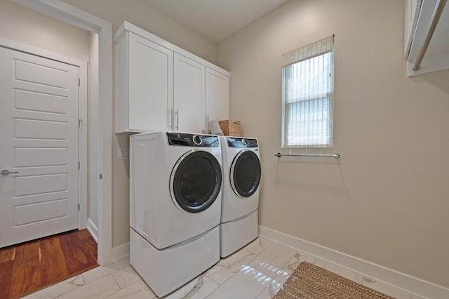 3102 Hunt Trl, Austin, TX 78757 - clothes washing area featuring washer and clothes dryer, cabinet space, baseboards, and light marble finish floors