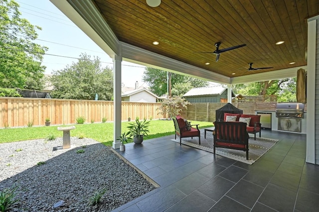 3102 Hunt Trl, Austin, TX 78757 - view of patio / terrace with grilling area, a ceiling fan, exterior kitchen, and an outdoor living space