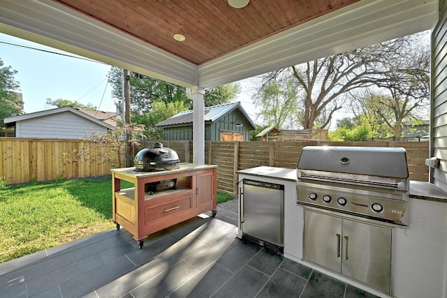 3102 Hunt Trl, Austin, TX 78757 - view of patio featuring exterior kitchen and grilling area