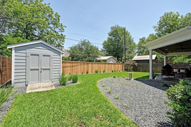 3102 Hunt Trl, Austin, TX 78757 - view of yard with a storage shed, ceiling fan, an outbuilding, and a patio