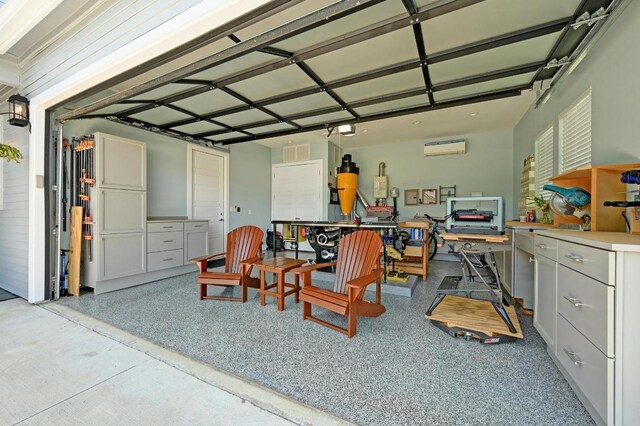 3102 Hunt Trl, Austin, TX 78757 - garage featuring a wall mounted air conditioner