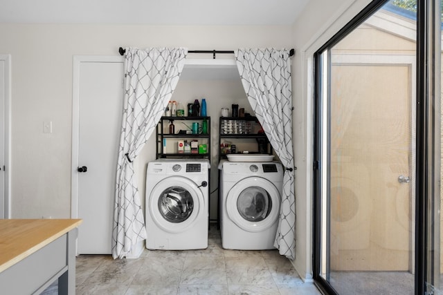 washroom featuring washer and dryer