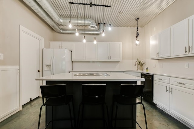 5307 Shady Oaks Cir, Kingsland, TX 78639 - kitchen featuring finished concrete flooring, dishwasher, a kitchen island, white fridge with ice dispenser, and light countertops