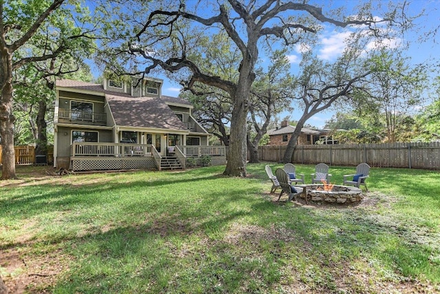 5307 Shady Oaks Cir, Kingsland, TX 78639 - view of yard with an outdoor fire pit and a balcony