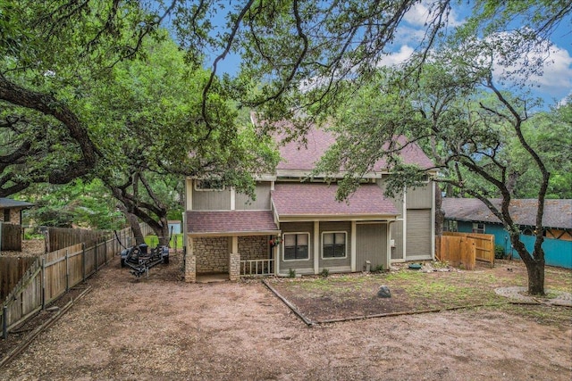 5307 Shady Oaks Cir, Kingsland, TX 78639 - rear view of house with fence and roof with shingles