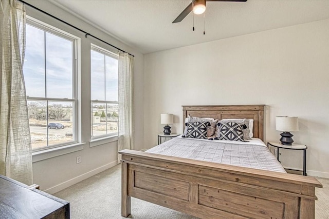 2600 Gattis School Rd Unit 401, Round Rock, TX 78664 - bedroom featuring light carpet, multiple windows, and baseboards
