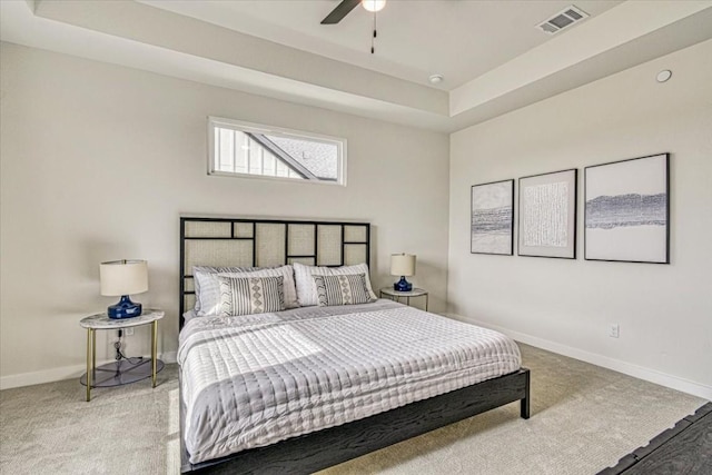 2600 Gattis School Rd Unit 401, Round Rock, TX 78664 - bedroom with baseboards, light colored carpet, a tray ceiling, and ceiling fan
