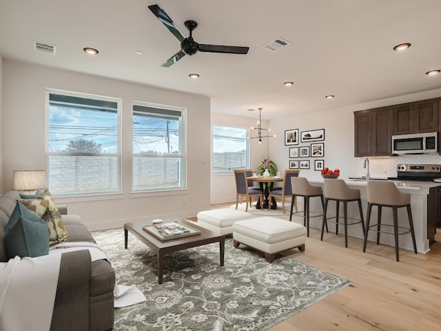 2600 Gattis School Rd Unit 401, Round Rock, TX 78664 - living room featuring a ceiling fan, light wood finished floors, and recessed lighting
