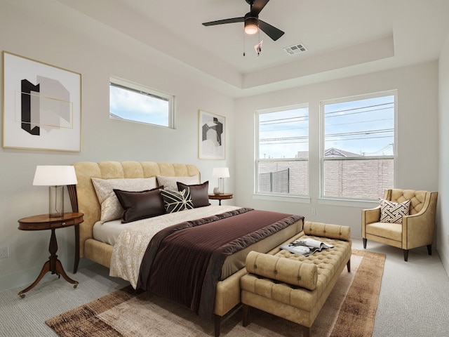 2600 Gattis School Rd Unit 401, Round Rock, TX 78664 - bedroom featuring carpet floors, a raised ceiling, and ceiling fan