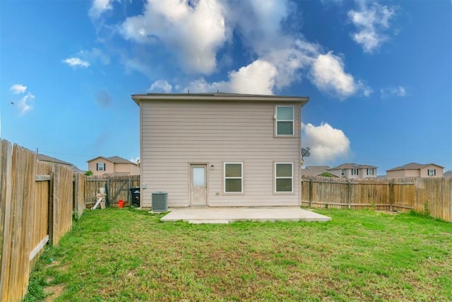 rear view of house featuring a patio area and central AC unit