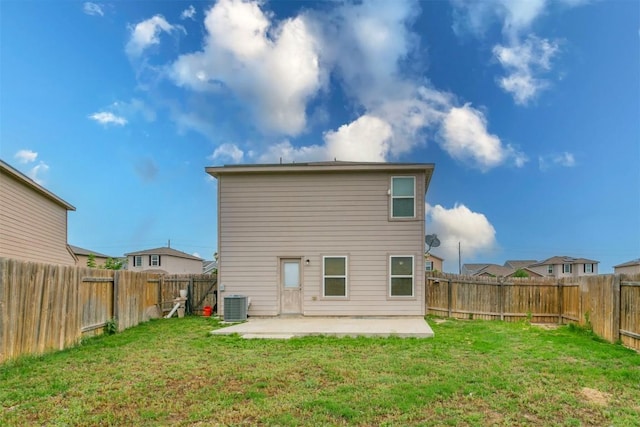 rear view of house with a patio area and central air condition unit