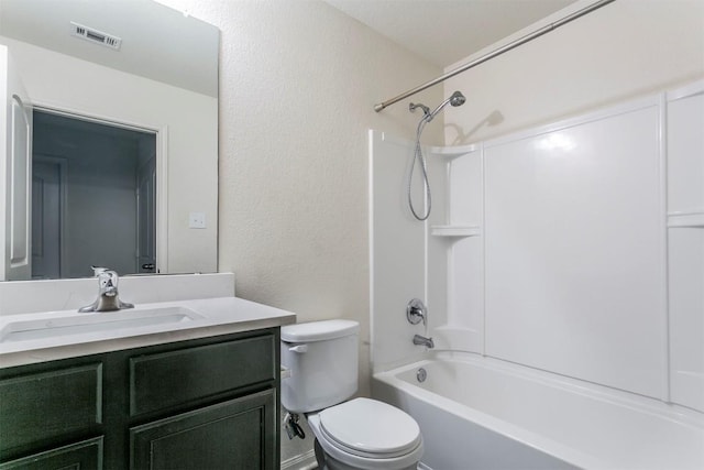 full bathroom with toilet, a textured wall, vanity, and bathing tub / shower combination