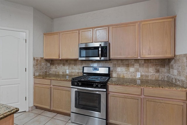 4329 Rock Hill Rd, Round Rock, TX 78681 - kitchen with appliances with stainless steel finishes, light brown cabinetry, tasteful backsplash, and stone counters