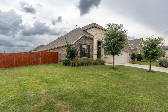 115 Oleander Loop, Buda, TX 78610 - view of front of home with driveway, brick siding, a garage, and a shingled roof