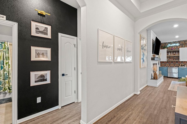 115 Oleander Loop, Buda, TX 78610 - hall featuring wood finished floors and arched walkways