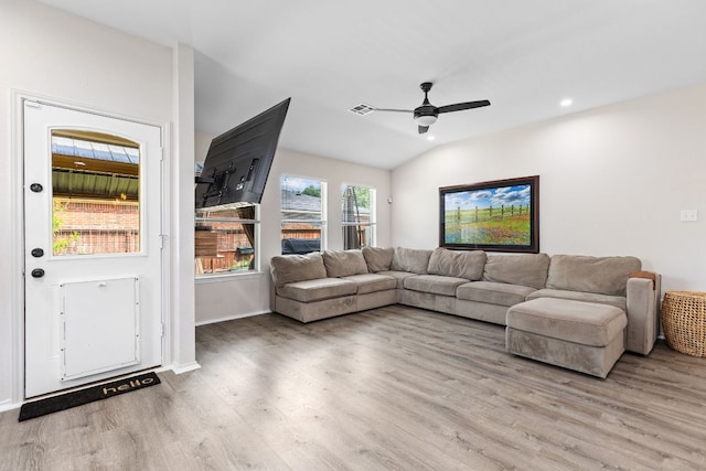 living room with wood finished floors, a ceiling fan, vaulted ceiling, recessed lighting, and baseboards