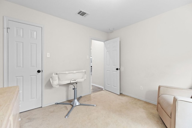 interior space with carpet floors and baseboards