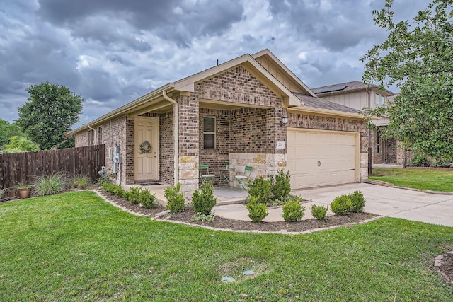 view of front of house with brick siding, a garage, and driveway