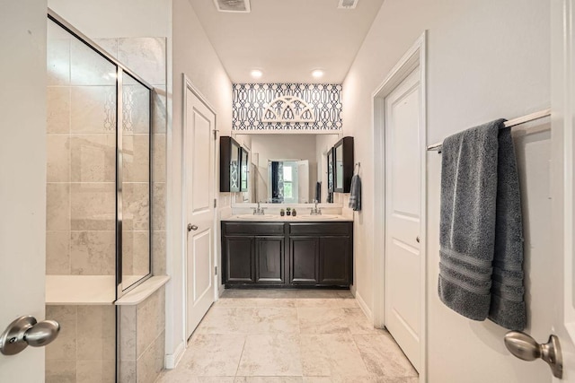full bathroom featuring a shower stall and double vanity