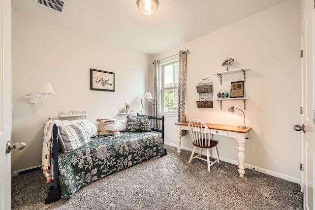 bedroom featuring carpet flooring, baseboards, and an office area