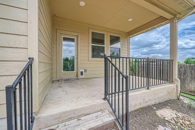 view of patio / terrace featuring fence