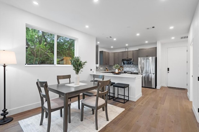 1208 W Oltorf St Unit B, Austin, TX 78704 - dining area featuring light wood-style flooring and recessed lighting