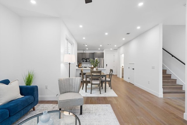1208 W Oltorf St Unit B, Austin, TX 78704 - living room featuring recessed lighting, light wood-style flooring, and stairs