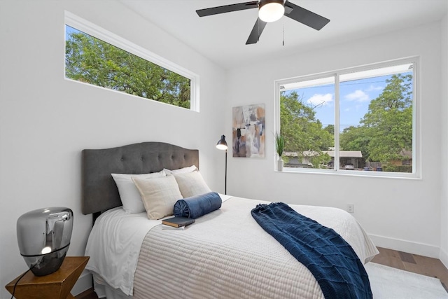 1208 W Oltorf St Unit B, Austin, TX 78704 - bedroom with wood finished floors, multiple windows, and ceiling fan