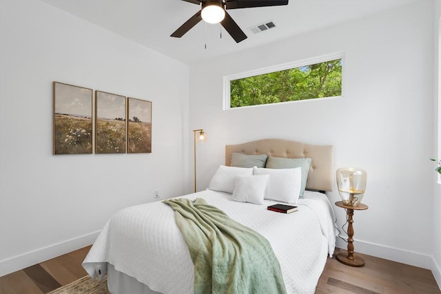 1208 W Oltorf St Unit B, Austin, TX 78704 - bedroom with baseboards, wood finished floors, and a ceiling fan