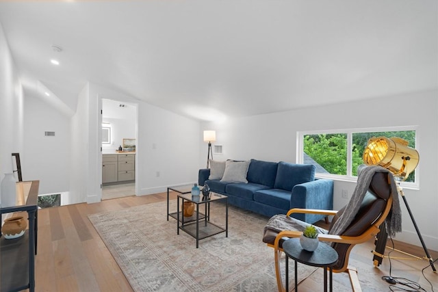 1208 W Oltorf St Unit B, Austin, TX 78704 - living room with light wood-style flooring, vaulted ceiling, and baseboards