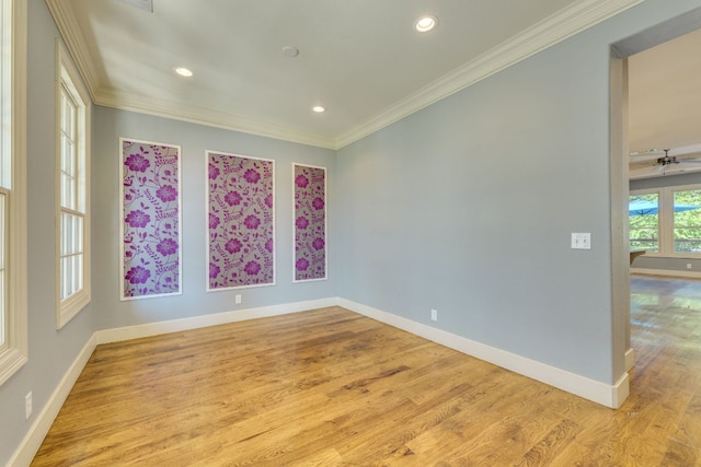 2112 W 11th St, Austin, TX 78703 - empty room featuring crown molding, wood finished floors, baseboards, and recessed lighting