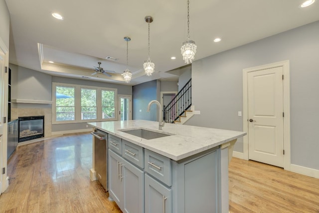 2112 W 11th St, Austin, TX 78703 - kitchen featuring a sink, gray cabinets, a ceiling fan, light wood-style flooring, and recessed lighting